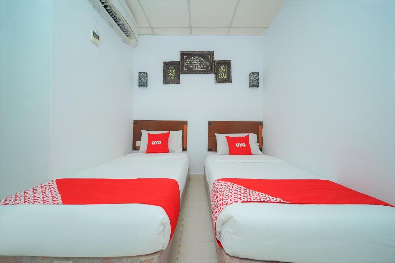 Oyo 89850 Mutiara Motel Kuah Bagian luar foto