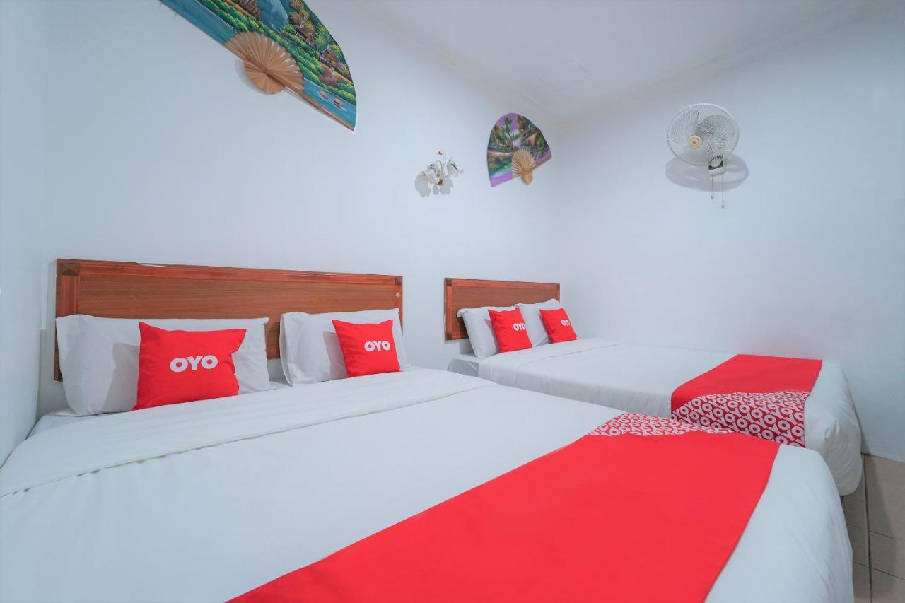 Oyo 89850 Mutiara Motel Kuah Bagian luar foto