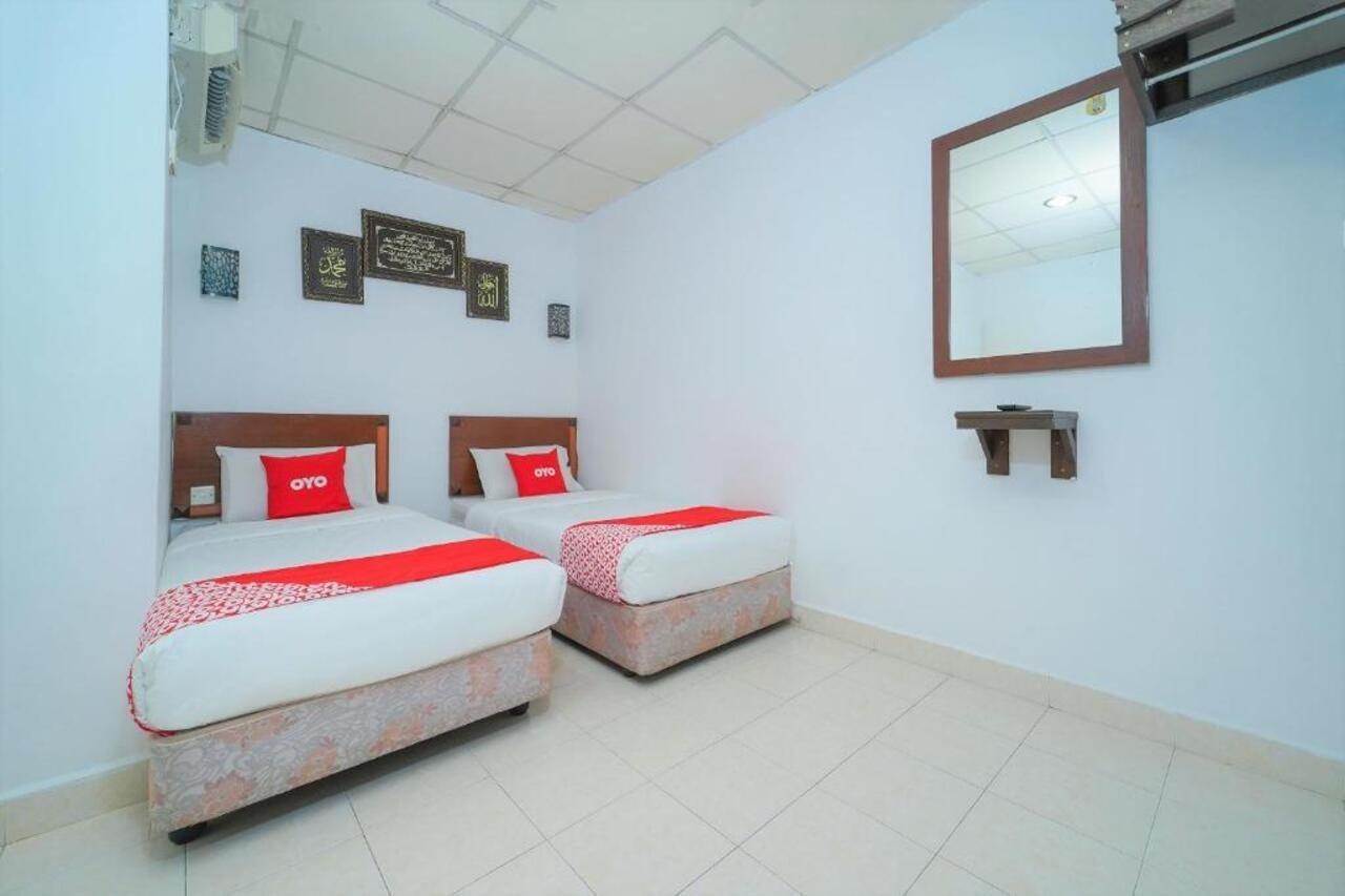 Oyo 89850 Mutiara Motel Kuah Bagian luar foto